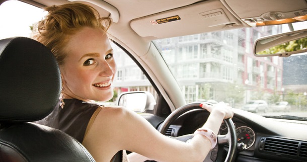 A woman who has reduced the cost to drive her car