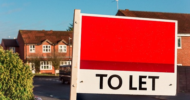 Buy to let sign and houses