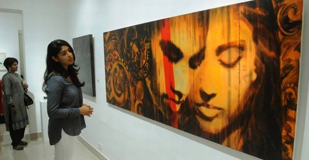Asian girl looking into art investments