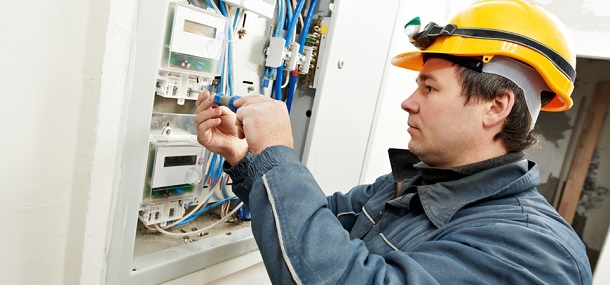 Electrician working on panel