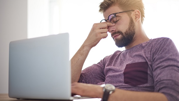 Stressed man on pc