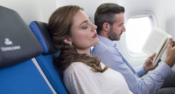 Woman sleeping on a plane
