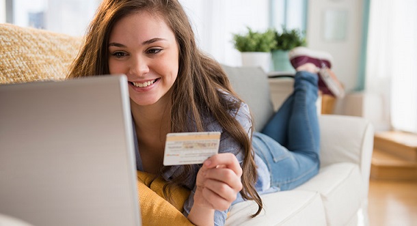 Girl online using credit builder card