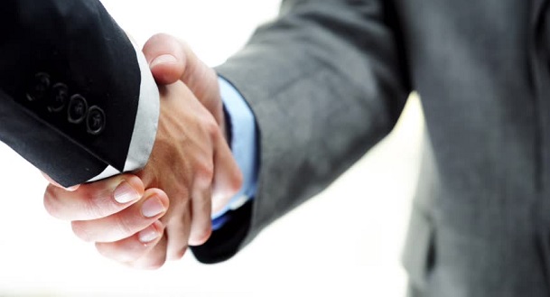 Men shaking hands on working capital finance agreement